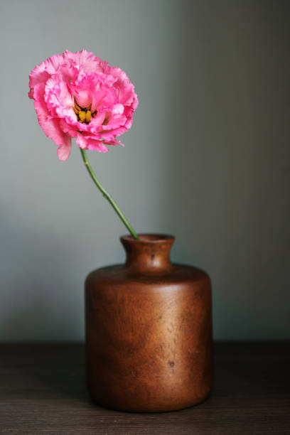 istock Pink peony in a vase by the wall 2157033232