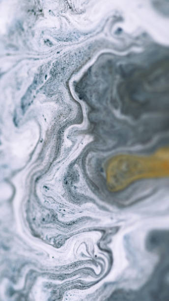 istock Ink fluid mix marble texture gray golden acrylic 2157033444