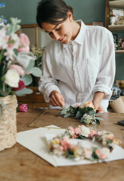 istock Florist arranging a bouquet of flower 2157033471