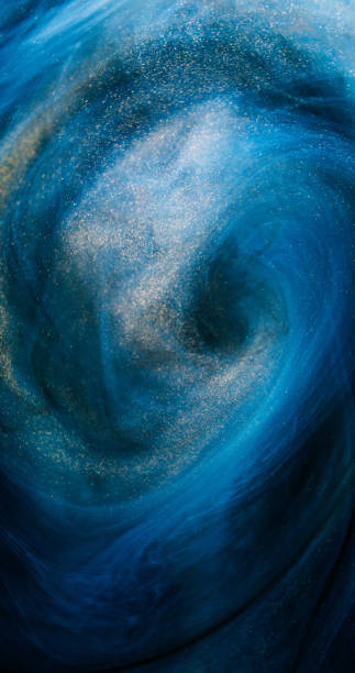 istock Glitter swirl mist vortex blue golden paint blend 2157035630