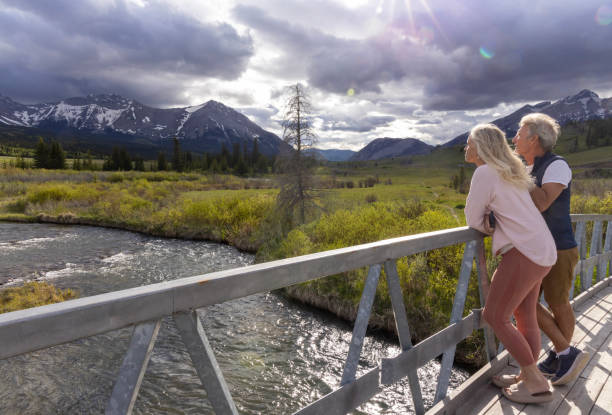 Senior couple look out to mountains