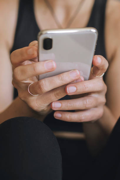 istock Woman using a mobile phone at home during the coronavirus quarantine 2157039839