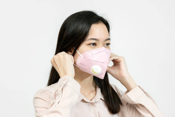 istock Asian girl wearing a face mask 2157041326