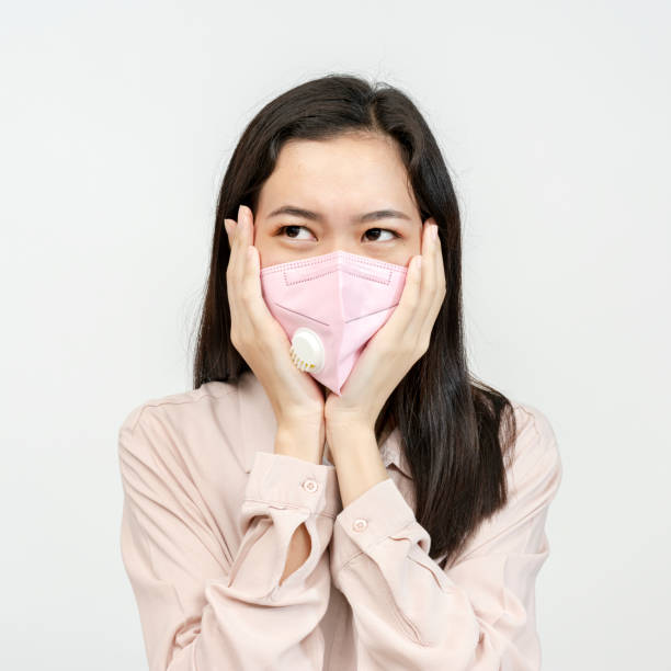 istock Asian girl wearing a face mask 2157041338