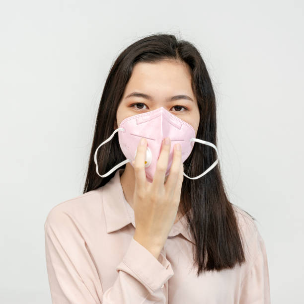 istock Asian woman wearing a mask 2157041362