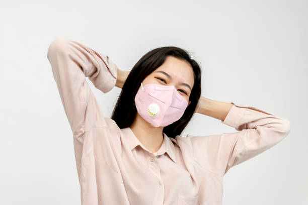 istock Asian girl wearing a face mask 2157041363