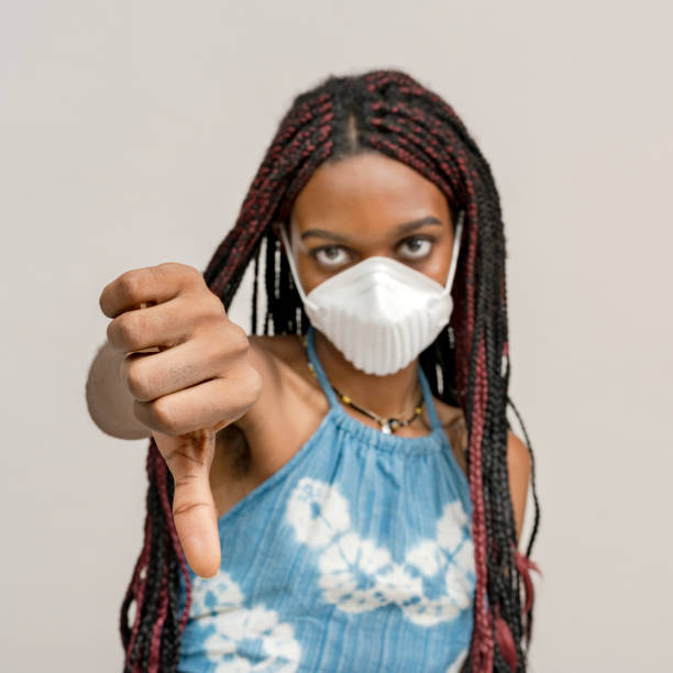 istock Black girl wearing an air pollution mask 2157041387