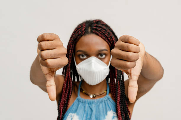 istock Black girl wearing an air pollution mask 2157041399