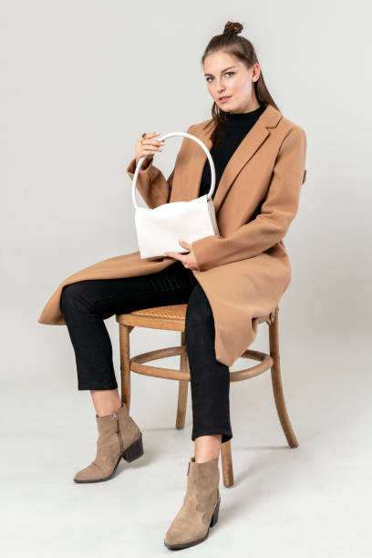 istock Woman with a white hand bag 2157042268