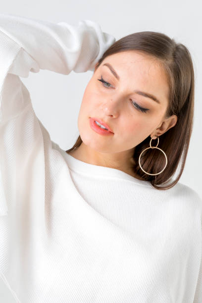 istock Cheerful woman wearing white sweater 2157042396