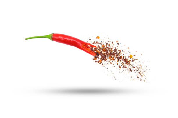 istock Flying red chili pepper with powder movement isolated. 2157042678