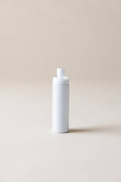 istock White blank spray bottle on a beige background 2157042735
