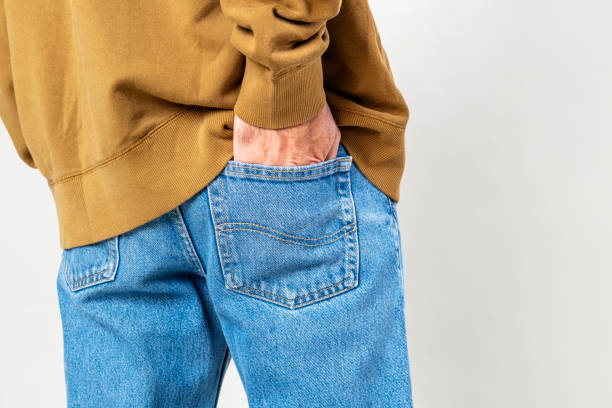 istock Man put his hand into back pocket of jeans 2157042957