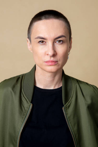 istock Serious skinhead woman in studio shoot 2157043044