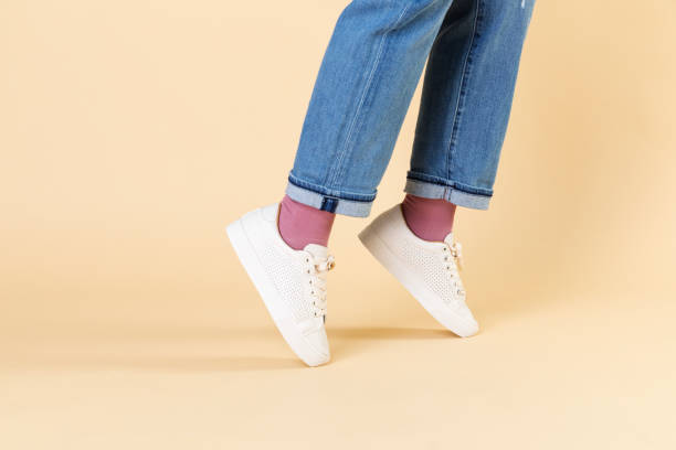 istock Woman wearing jeans and white sneakers 2157043206