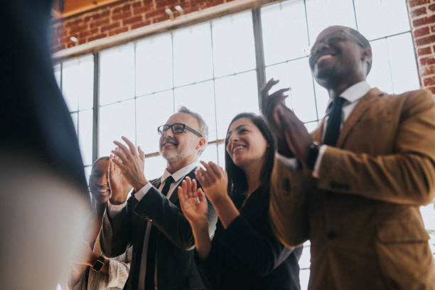 istock Diverse business people applauding with joy 2157043302