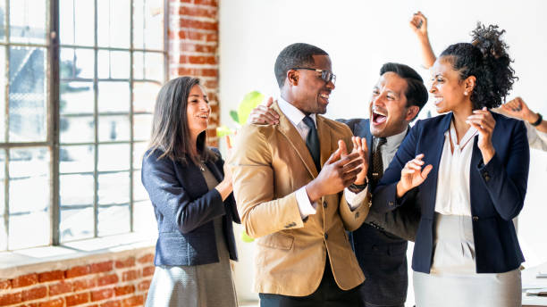 istock Diverse business people applauding with joy 2157043636