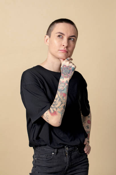 istock Thoughtful model with tattoos in black T shirt 2157044117