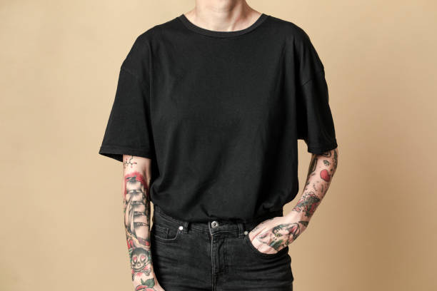 istock Tattooed model in black t shirt and jeans 2157044139