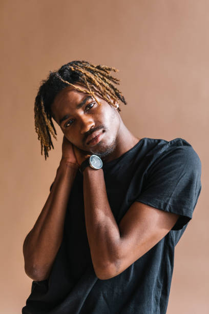 istock Black man with hands by his cheek 2157044334