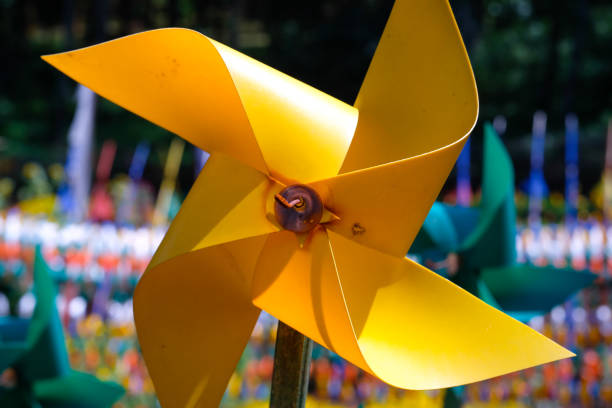Close-up of plastic Yellow Pinwheel in amusement park. Abstract Background of ornament in amusement park. Graphic Resources. Macro Photography. Travel Destinations. Holiday photography concept
