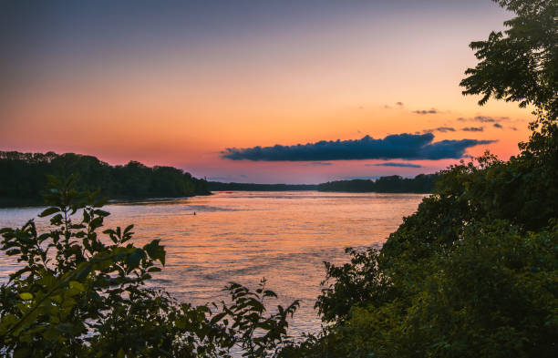 istock Colorful sunset on Midwestern river in fall; sunlight reflect in water 2157047021