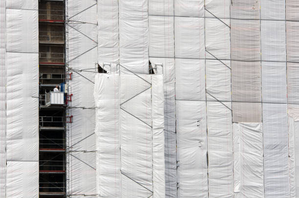 istock tarpaulin on a building 2157047615