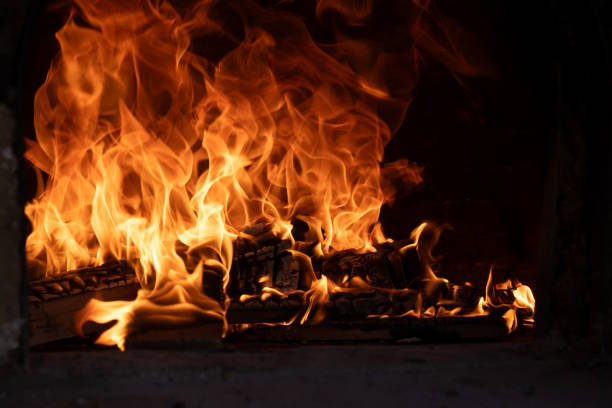 istock Fire and burn coals in stone oven. Oven made of bricks and clay. 2157049331