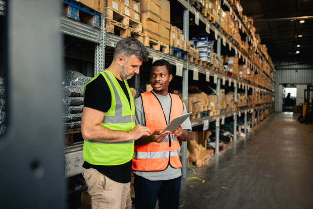 istock Manager and his worker from the warehouse checking stored goods 2157050665