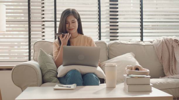 istock Asian woman using smartphone at home, working at home,virtual assistant 2157052224