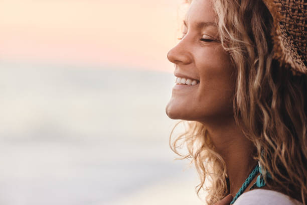 istock Happy woman enjoying on the beach. 2157053522