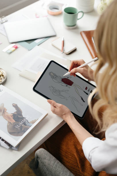 istock Fashion designer drawing on a digital tablet 2157055827