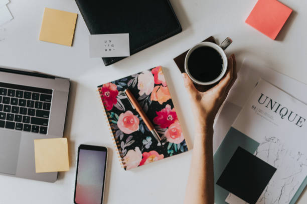 istock Mobile phone on a feminine desk decor 2157055916