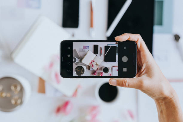 istock Woman taking photo with mobile phone 2157055934