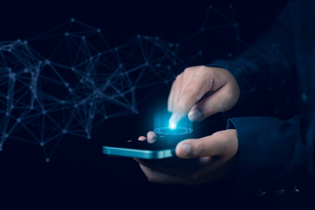 istock Businesswoman Scanning Fingerprints on Smartphone with Virtual Screen for Secure Data Storage and Protection Against Unauthorized Access and Cyber Threats 2157056595