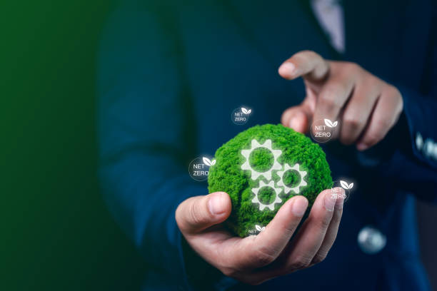 istock Green Simulated Globe in Businessman's Hand Displaying Virtual Screen on Waste Reduction, Carbon Management, and Preventing Global Warming to Protect Nature 2157056769