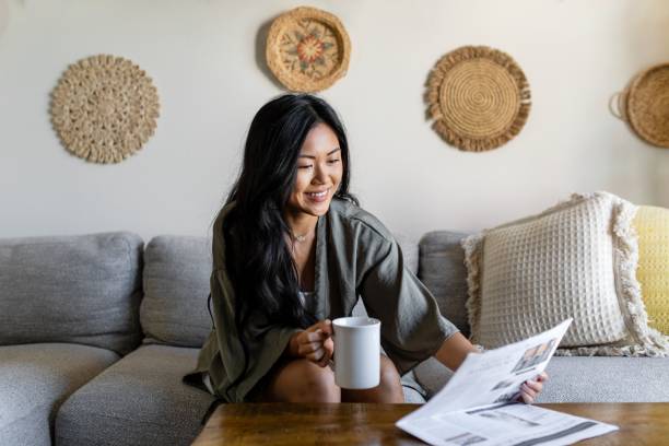 istock Morning routine, coffee & newspaper on the sofa 2157058881