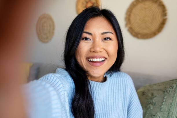 istock Woman saying hello, distance relationship through video call 2157059345