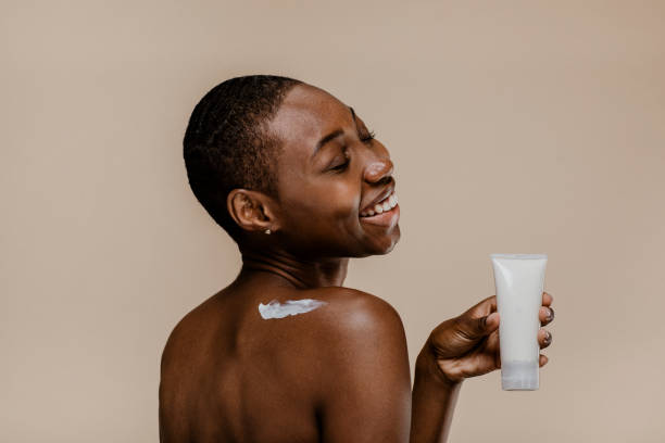 istock Happy black woman with a container mockup 2157060056