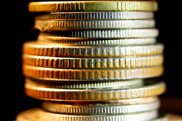 Photos of the sides of coins of different denominations. causing different details or colors to be seen