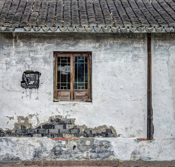 istock The traditional window and brick wall of old building. 2157061776