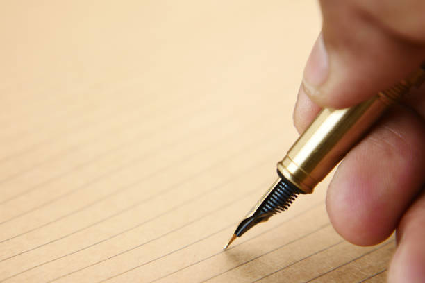 Close-Up High Angle View Of Pen Over White Background
