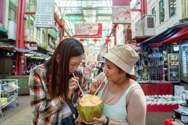 istock Quenching thirst and bonding, coconut connections 2157062782