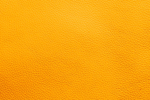 istock Textured Yellow Leather Material Close-up 2157063074