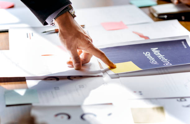 istock Hand pointing on a marketing strategy document 2157064051