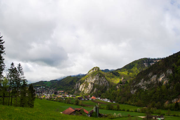A Scenic green valley with houses and trees