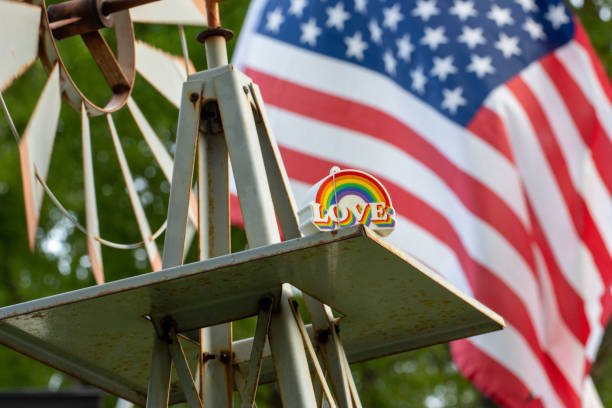 Pride celebration decor with rainbow-colored items in nature
