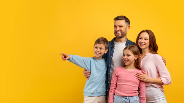 istock Family pointing and looking to the side 2157066181