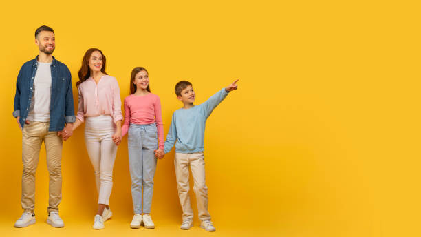 istock Family pointing and looking to the side 2157066253