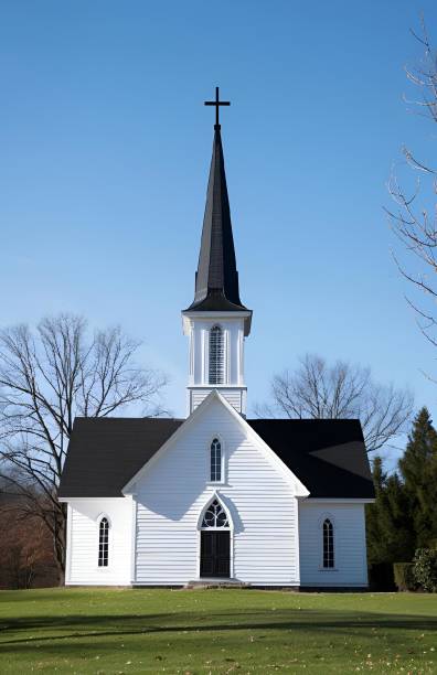 Church with a tall steeple in a green field